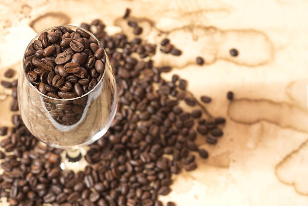 istock coffee bean in the glass on old paper 482494132