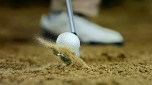 HD Super Slow-Mo: Hitting Ball From Sand Trap
