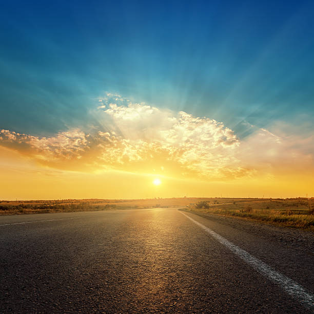 istock asphalt road and sunset in clouds 482499730