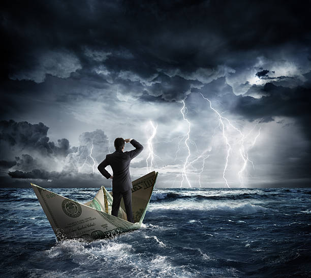 dollar boat in the bad weather businessman on dollar boat with storm and lightning water crisis stock pictures, royalty-free photos & images