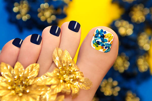 istock Blue pedicure with butterflies. 482500305