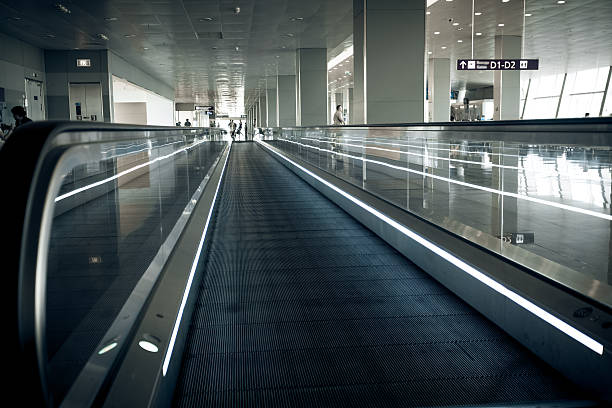 istock long horizontal escalator at international airport terminal 482500440