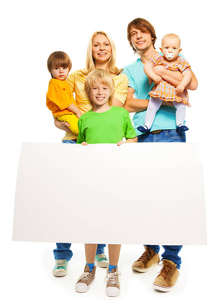 istock Young family with blank advertising banner 482501039