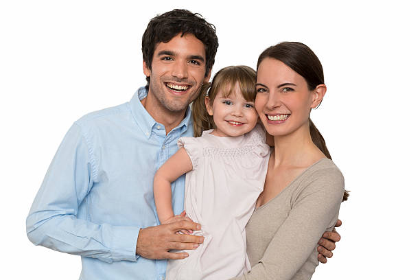 Happy  young Family standing on white background, isolated stock photo