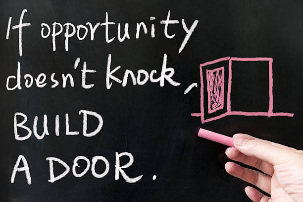 If opportunity doesn't knock, build a door stock photo