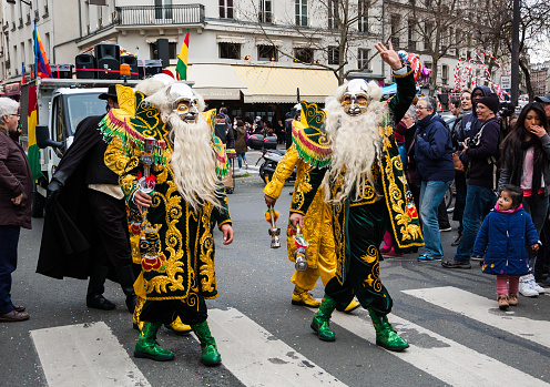 Paris, France - March 2, 2014: Bolivian community procession at the traditional Carnival in Paris. Colorful Carnaval de Paris is annual event, which history starts from the sixteenth century.