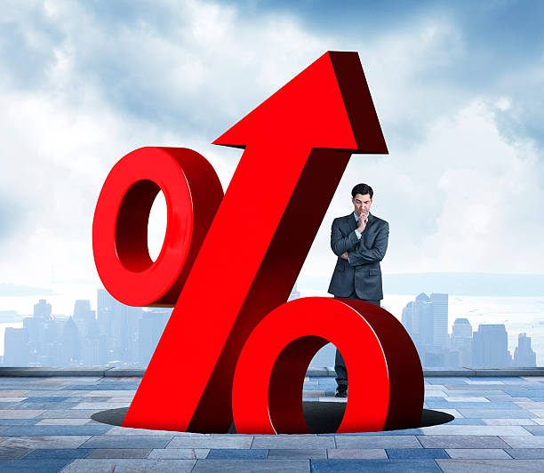 istock Businessman Watching Rising Interest rates Emerging From Hole 482505350