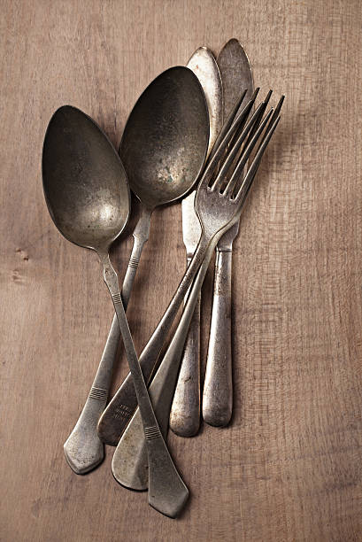 istock vintage silver cutlery fork spoon on wooden backdrop ... 482505856