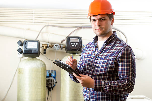istock male worker inspecting work of industrial equipment 482506526