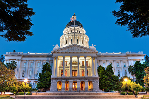 The California State Capitol building at dusk.