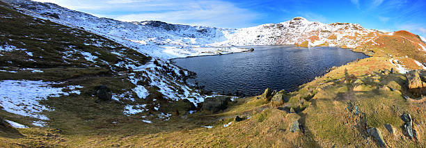 Easedale Tarn A Winters walk from Grasmere up to Easedale Tarn via Sour Milk Gill. grasmere stock pictures, royalty-free photos & images