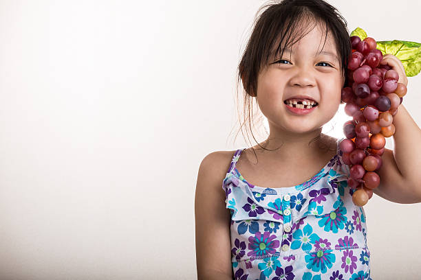 istock Child Holding Grapes / Child Holding Grapes Background 482510324