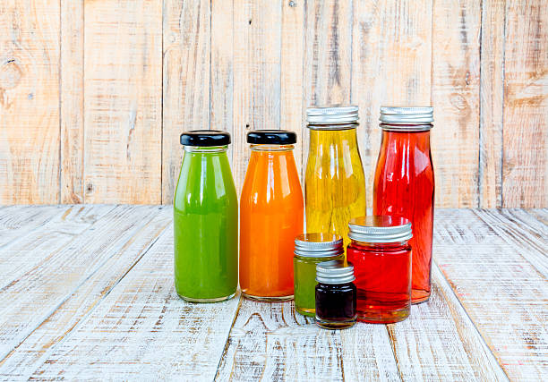 istock Juice bottle on wooden background 482511988