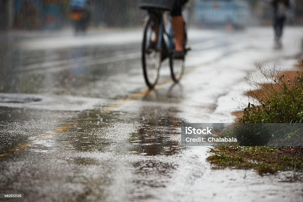 Heavy rain Heavy rain on the road in the city Cycling Stock Photo