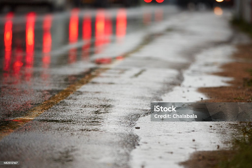 Heavy rain Heavy rain on the road and reflection of the tail lights. Asphalt Stock Photo