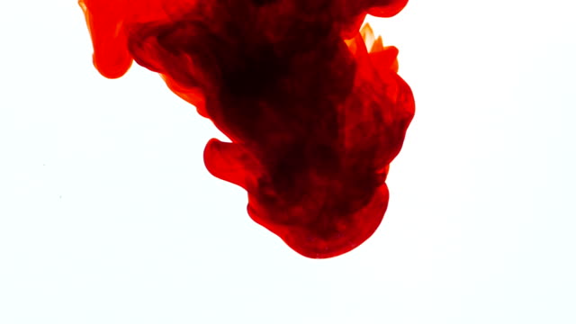 Red ink in water, slow motion, abstract.