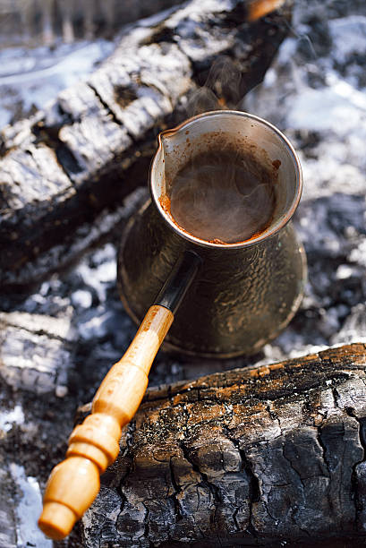istock Making coffee in the fireplace  on camping or hiking 482512396