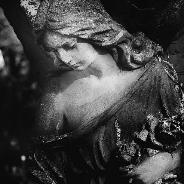 istock Vintage image of a sad angel on a cemetery 482516614
