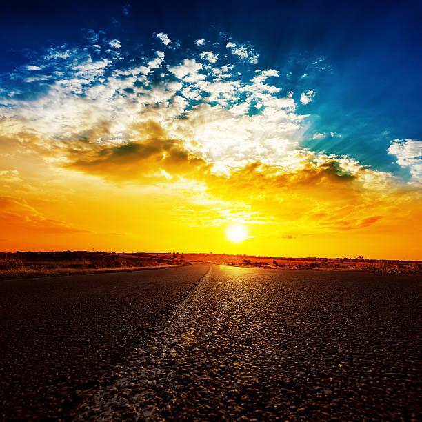 istock bright sunset and asphalt road to horizon 482516988
