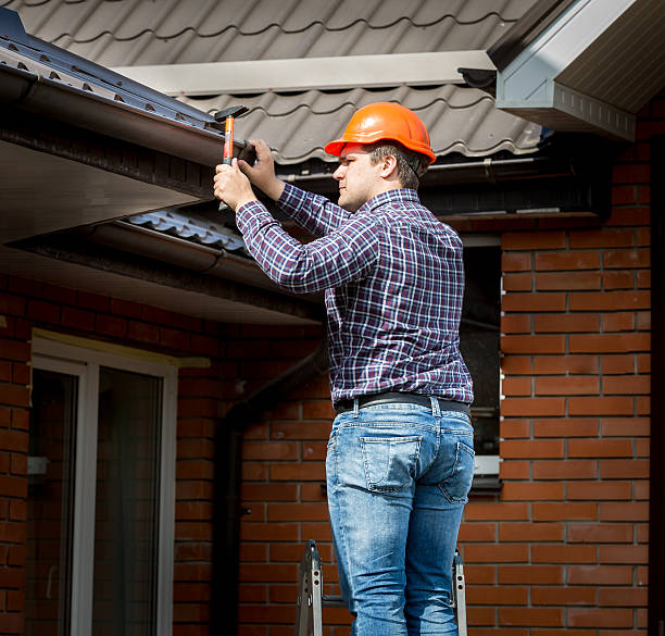 istock carpenter hammering roof boards with hammer 482517228