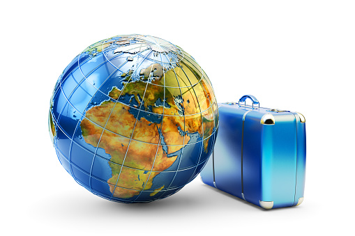 Blue vintage suitcase and Earth globe isolated on white background.