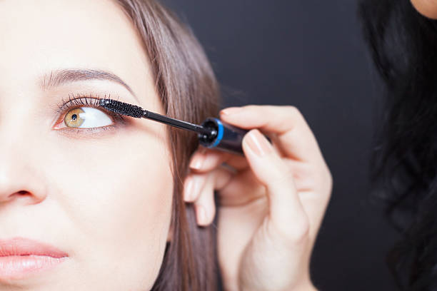istock makeup artist doing make up for beautiful arabian woman 482519450