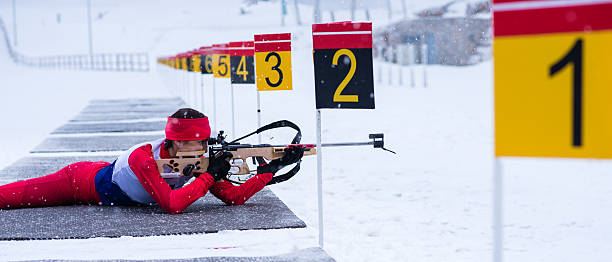 istock Panoramic shot of female shooting at biathlon training 482519890
