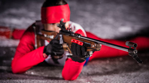 istock Female shooting at biathlon training at night 482519986