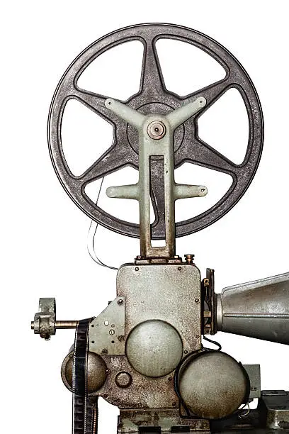 detail of an old and rusty cinema projector with film roll