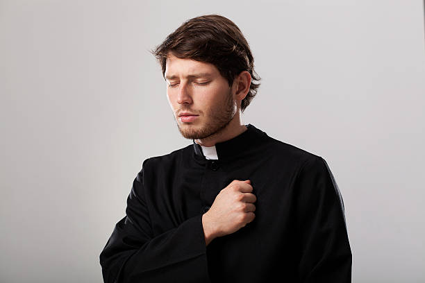 istock Priest is regretting for sins 482520347