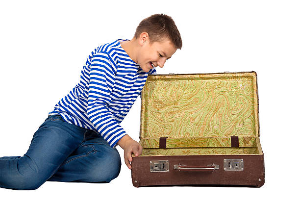istock teenager boy with a suitcase  isolated 482520927