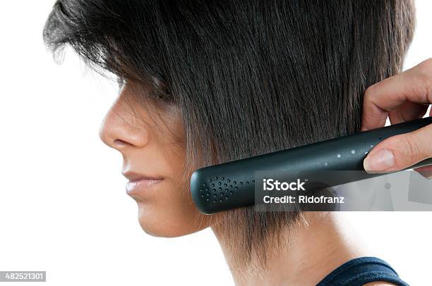 Straightening Hair Stock Photo - Download Image Now - Adjusting, Adult, Adults Only