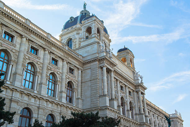 Vienna, Austria - August 31, 2022: Marble sculpture flanks the entrance of Belvedere Palace, emphasizing the artistic and architectural legacy of baroque Vienna. Classical stone figures guard the grand museum?s fa?ade.
