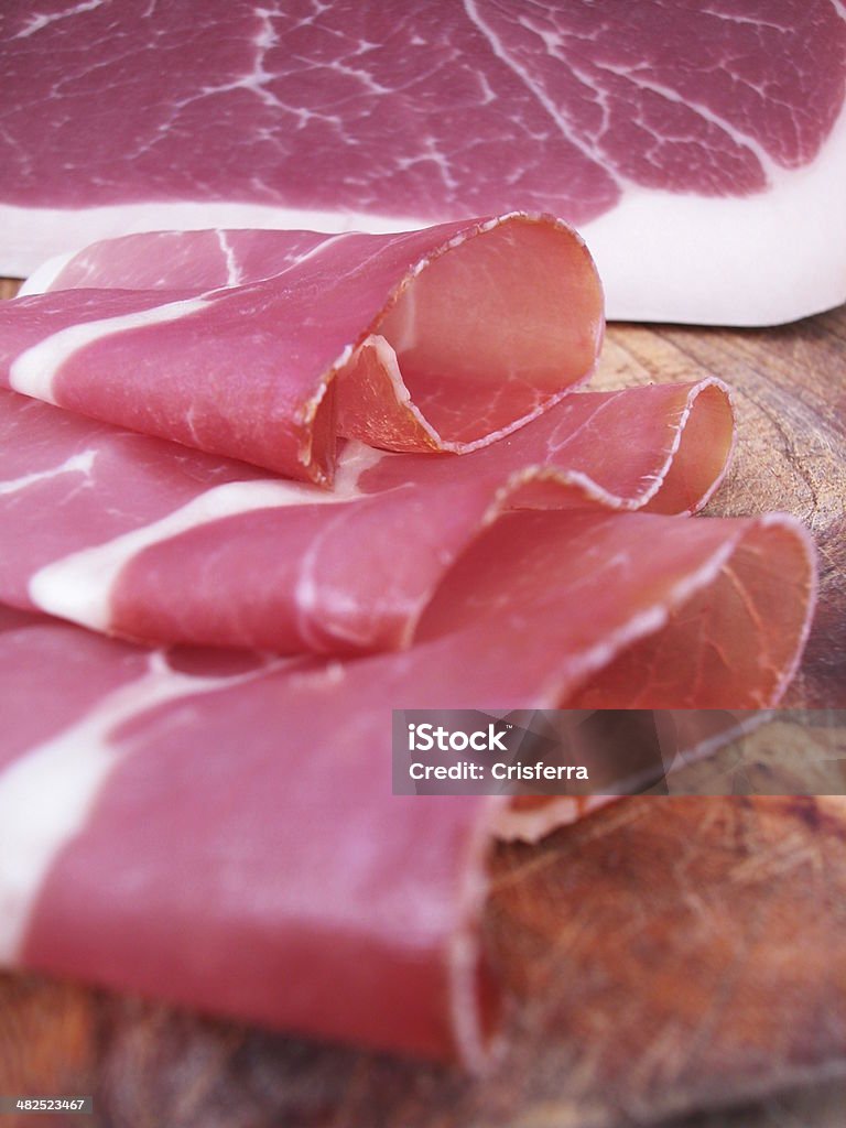 Fette di prosciutto di Parma - Foto stock royalty-free di Antipasto