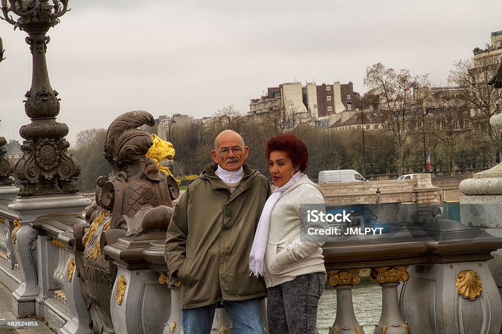 Lover visiting Paris on the Alexander III bridge A mature guy and a beautiful colored woman on the Alexander III bridge 40-49 Years Stock Photo