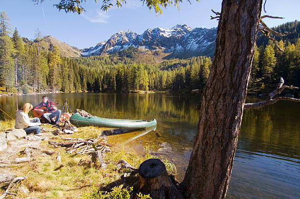 istock Young couple camping at lake 482524890