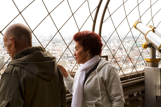 Lover admiring the landscape from the Eiffel Tower stock photo