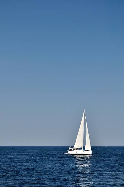 istock White boat on open blue sea, Croatia 482525969