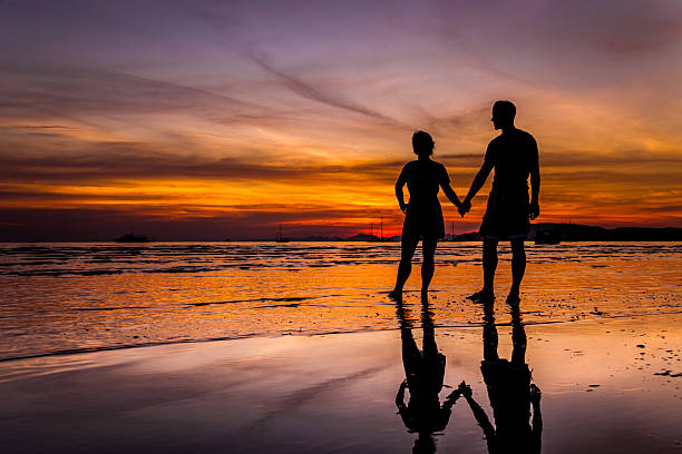 istock Couple on the beach at sunset in Krabi, Thailand 482531989