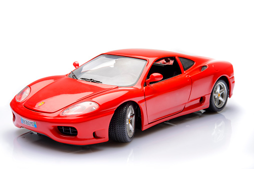 Kampen, The Netherlands - April 2, 2014: Ferrari 360 Modena sports car model by Bburago isolated on a white background.