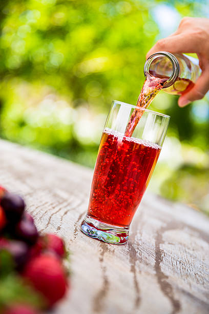 istock Berry fruit juice pouring in a glass 482535873