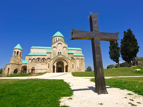 Front view of big cross in front of Bagrati Cathedral from 11th-century  in the city of Kutaisi, Georgia.