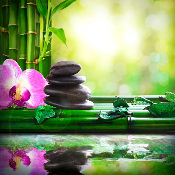 istock Stacked stones on bamboo reflected in water massage and relax 482536962