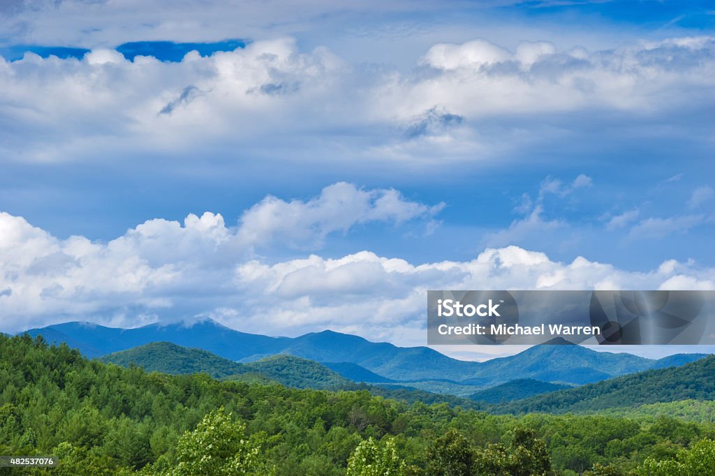 Scenic Overlook of Blue Ridge Mountains A panorama of the Blue Ridge Mountains in northern Georgia. A beautiful view in Georgia of the Blue Ridge Mountains with green trees and blue sky framing a distant range of mountains. Georgia - US State Stock Photo