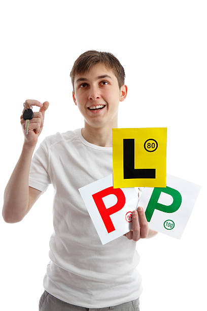 Teenager with car licence plates looking up