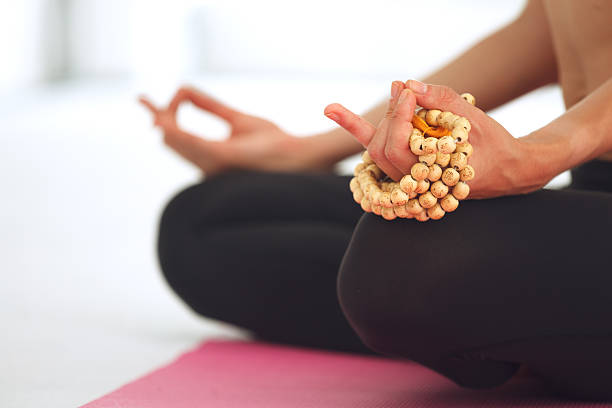 istock Young woman meditating in lotus pose. 482540882