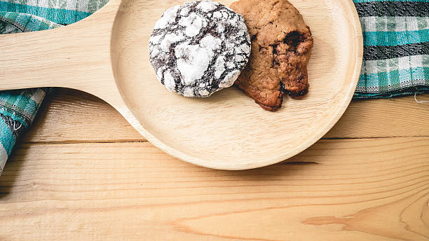 istock Cookies on a wooden pan and blue cloth. 482541142