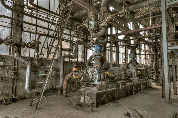 Old and rusty machinery in an abandoned plant stock photo