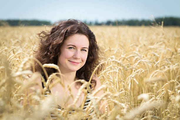 istock Girl in field with wheat. 482543040