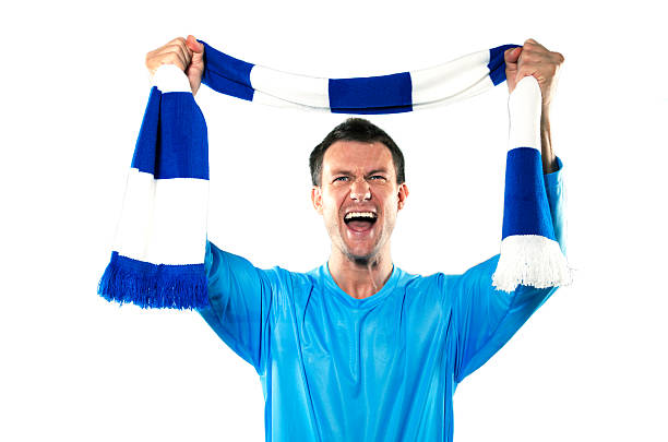Celebrating young soccer supporter with team scarf